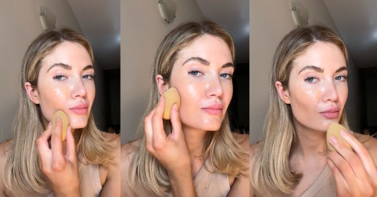Woman applying makeup with sponge, beauty tutorial.